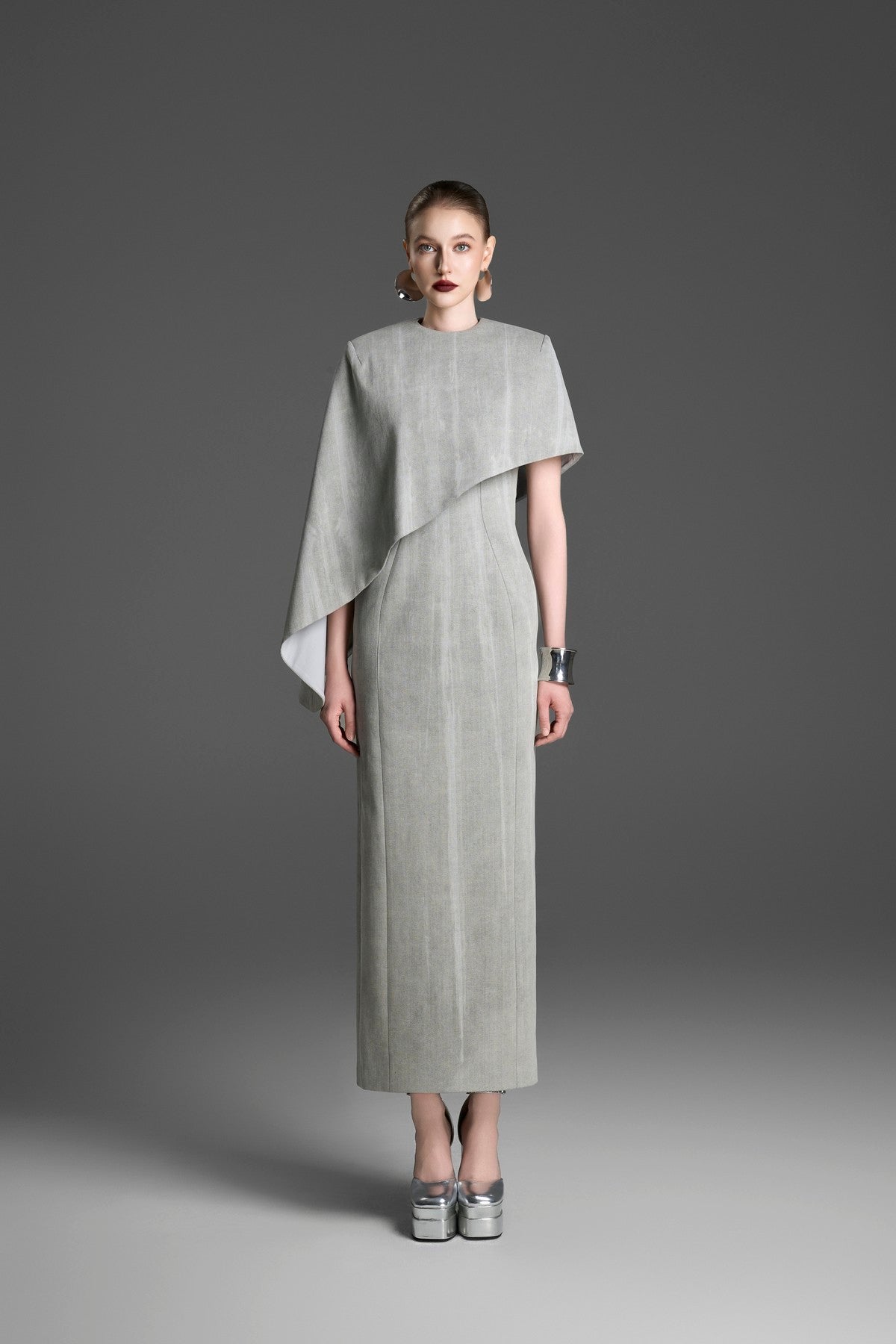 Asymmetrical Column Dress with a Single Draped Cape Sleeve