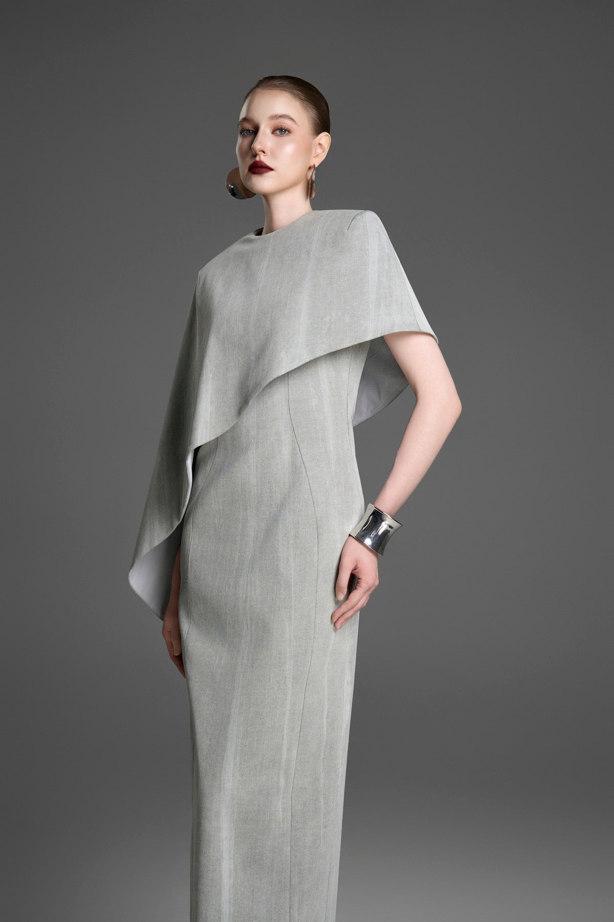 Asymmetrical Column Dress with a Single Draped Cape Sleeve