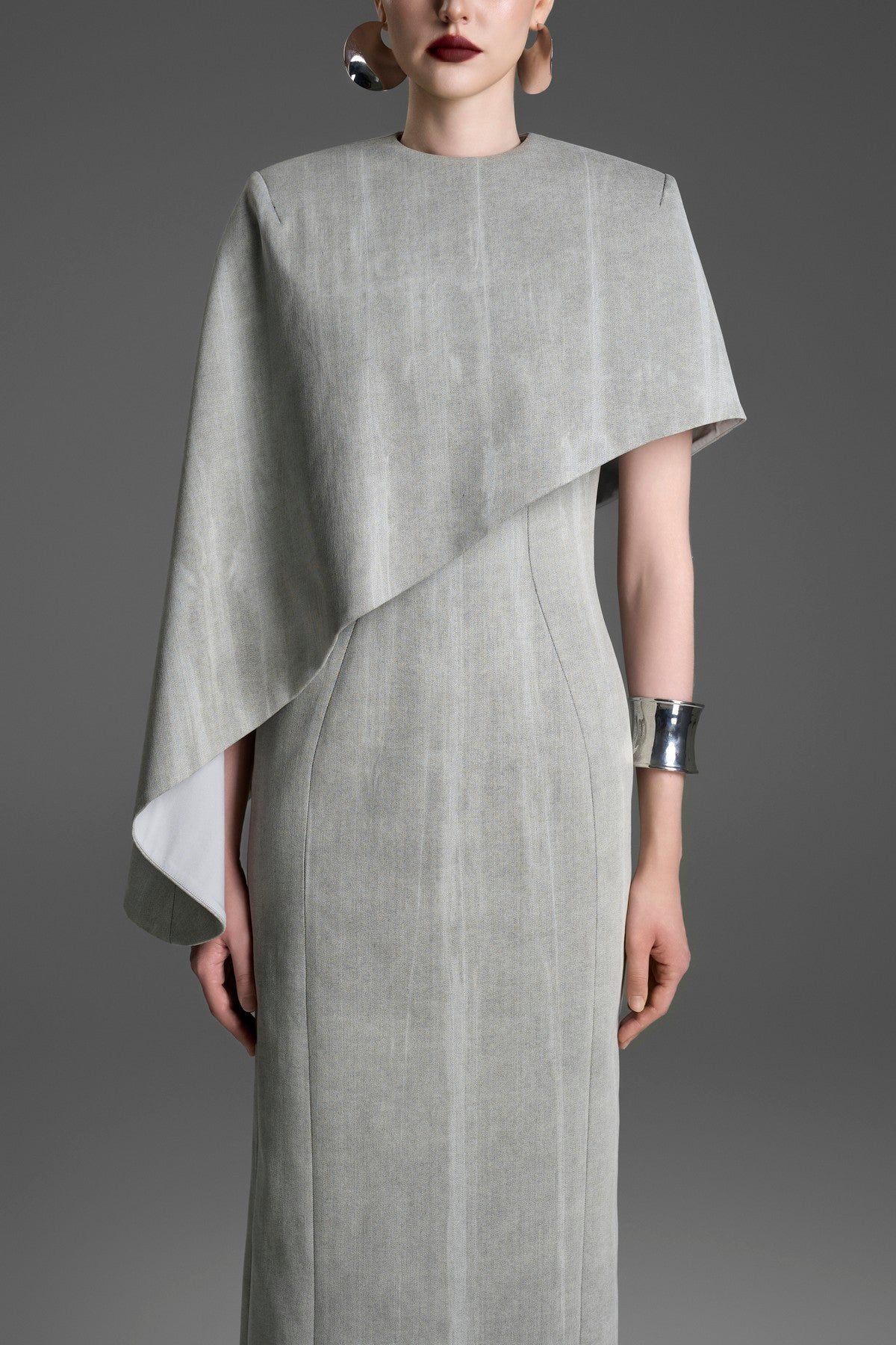 Asymmetrical Column Dress with a Single Draped Cape Sleeve