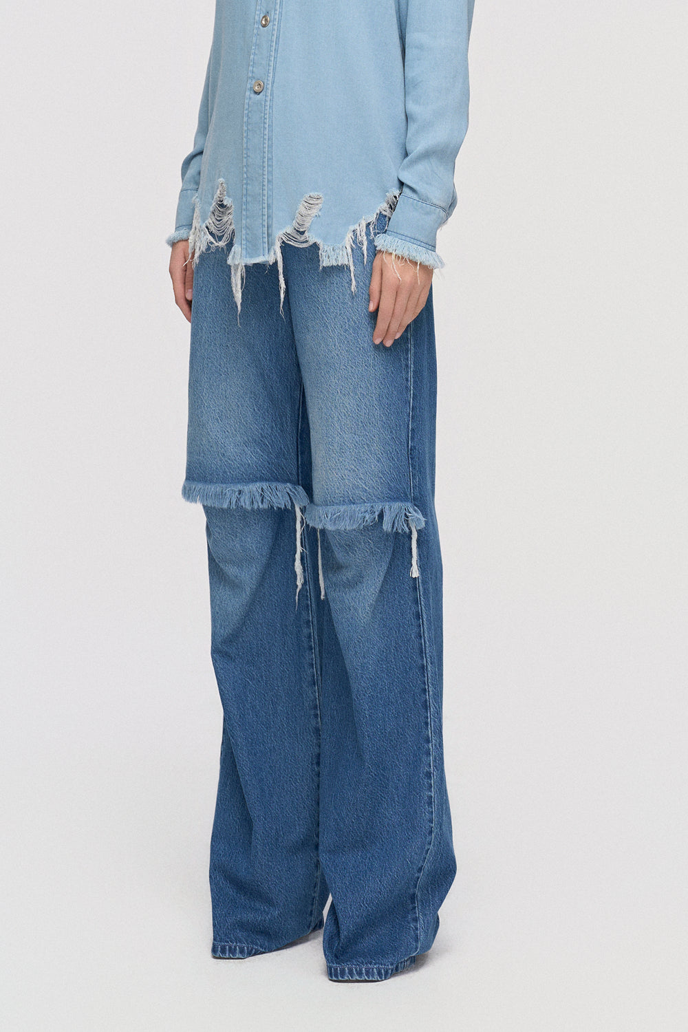 Trousers Straight-leg denim with raw edge knee cut out