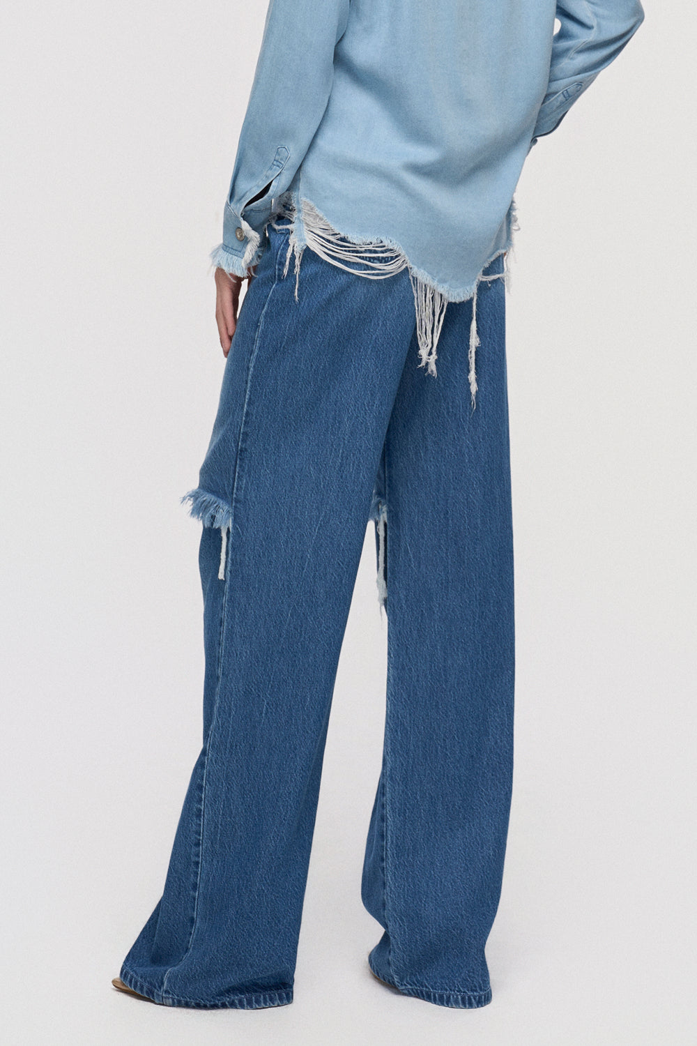 Trousers Straight-leg denim with raw edge knee cut out