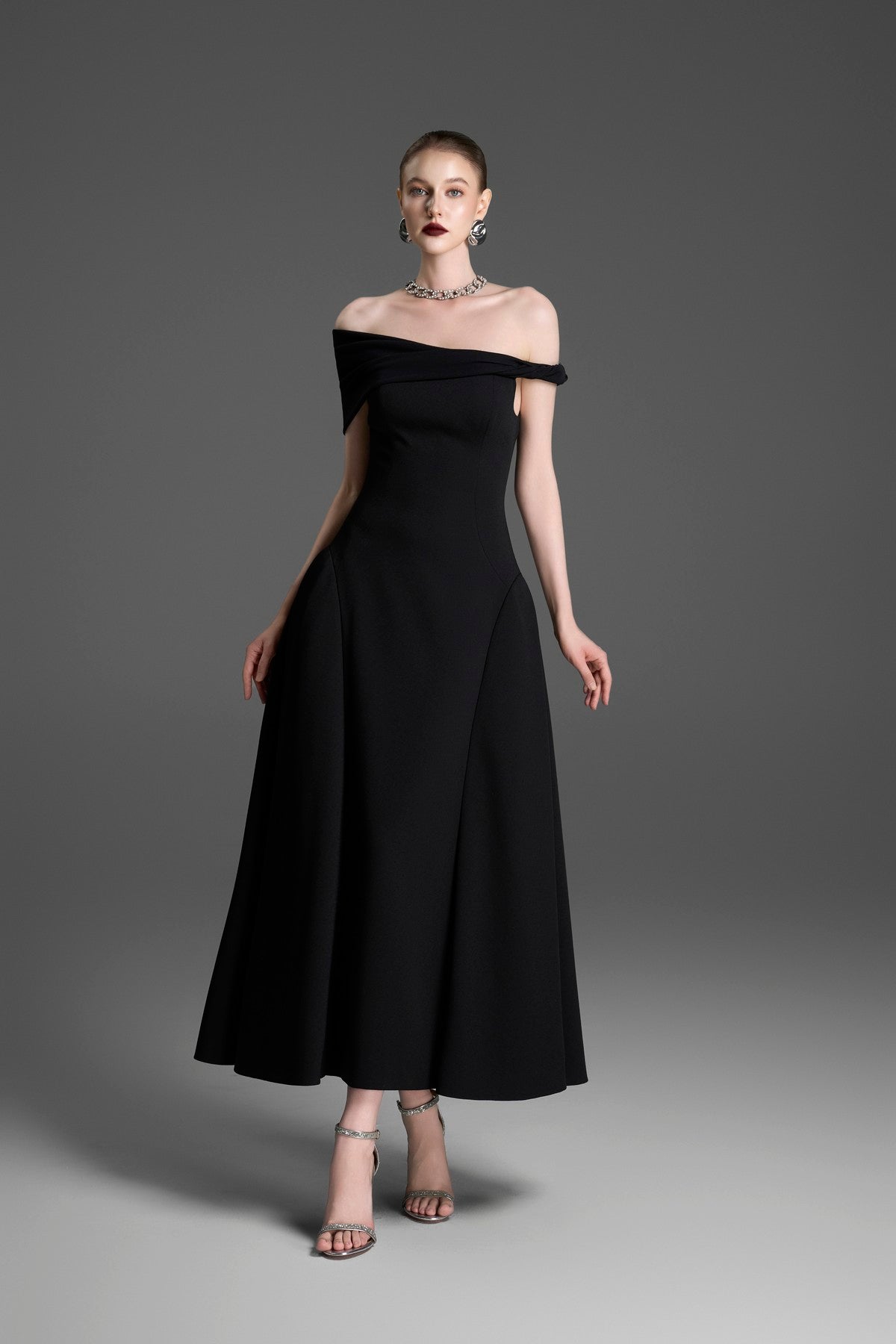 Asymmetrical Evening Gown with a Twisted Shoulder and Pleated Waist