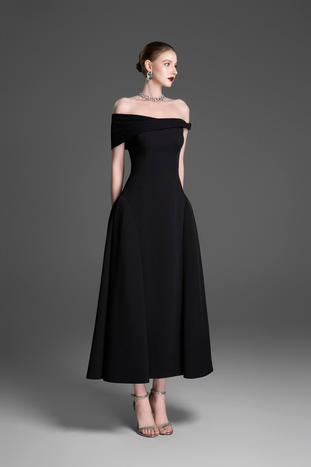 Asymmetrical Evening Gown with a Twisted Shoulder and Pleated Waist
