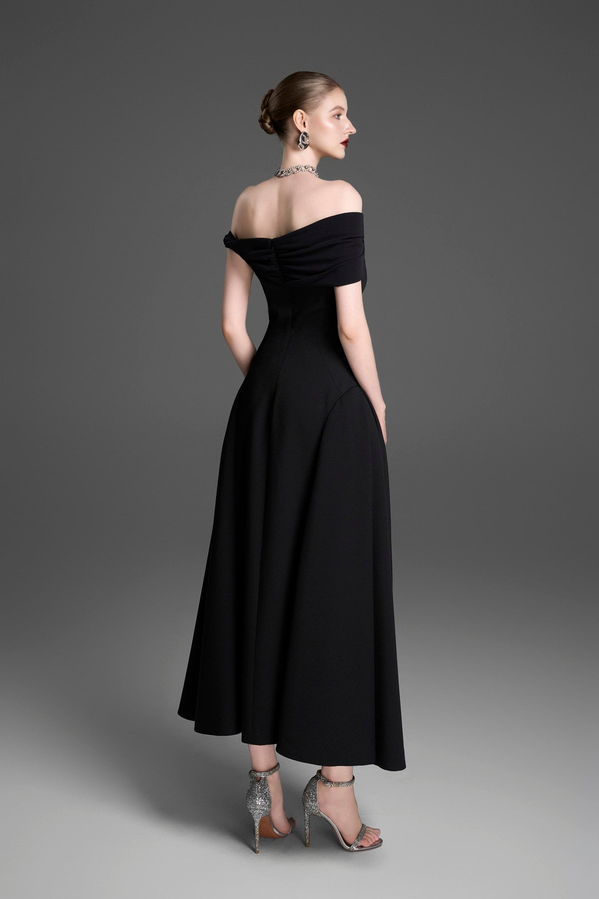 Asymmetrical Evening Gown with a Twisted Shoulder and Pleated Waist