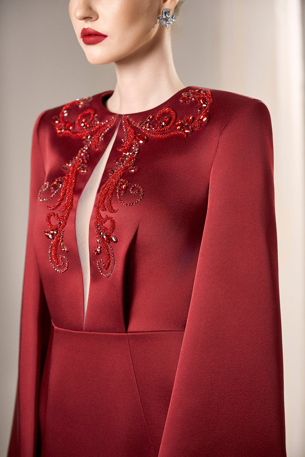 Dress Structured taffeta gown, crystal bodice, dramatic slit sleeves