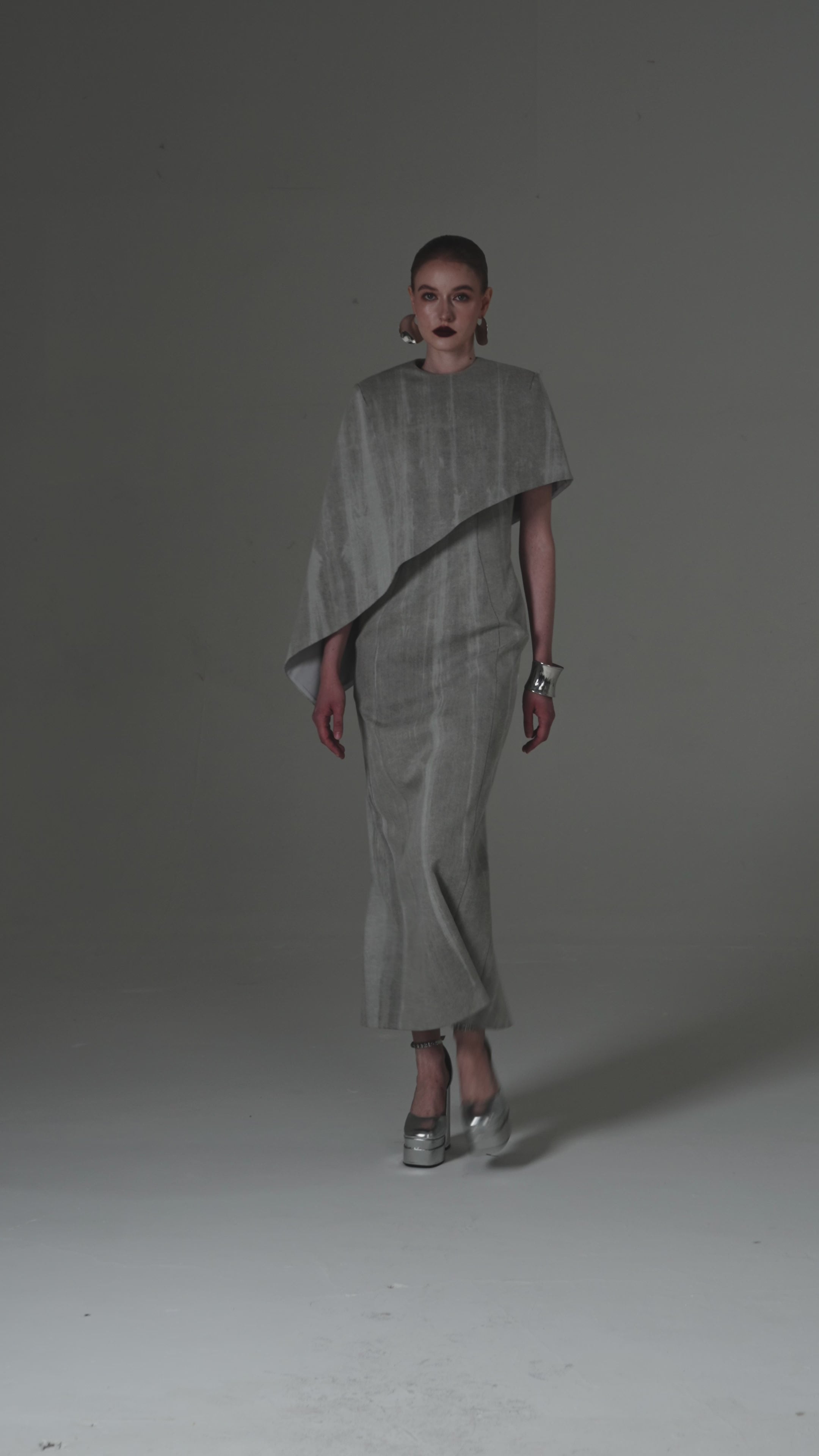 Asymmetrical Column Dress with a Single Draped Cape Sleeve