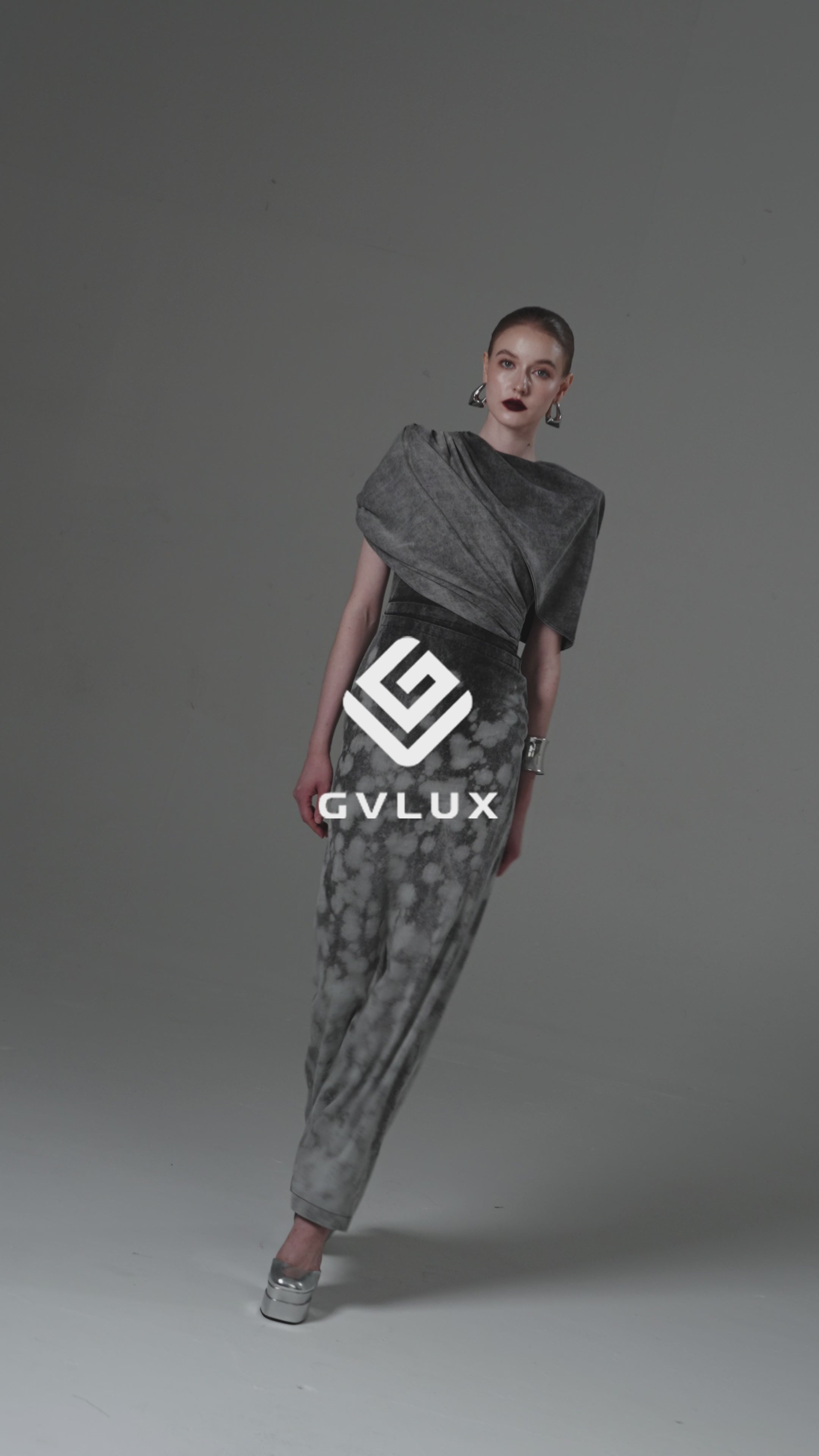 Sheath Dress with an Integrated Capelet and Asymmetrical Pleating